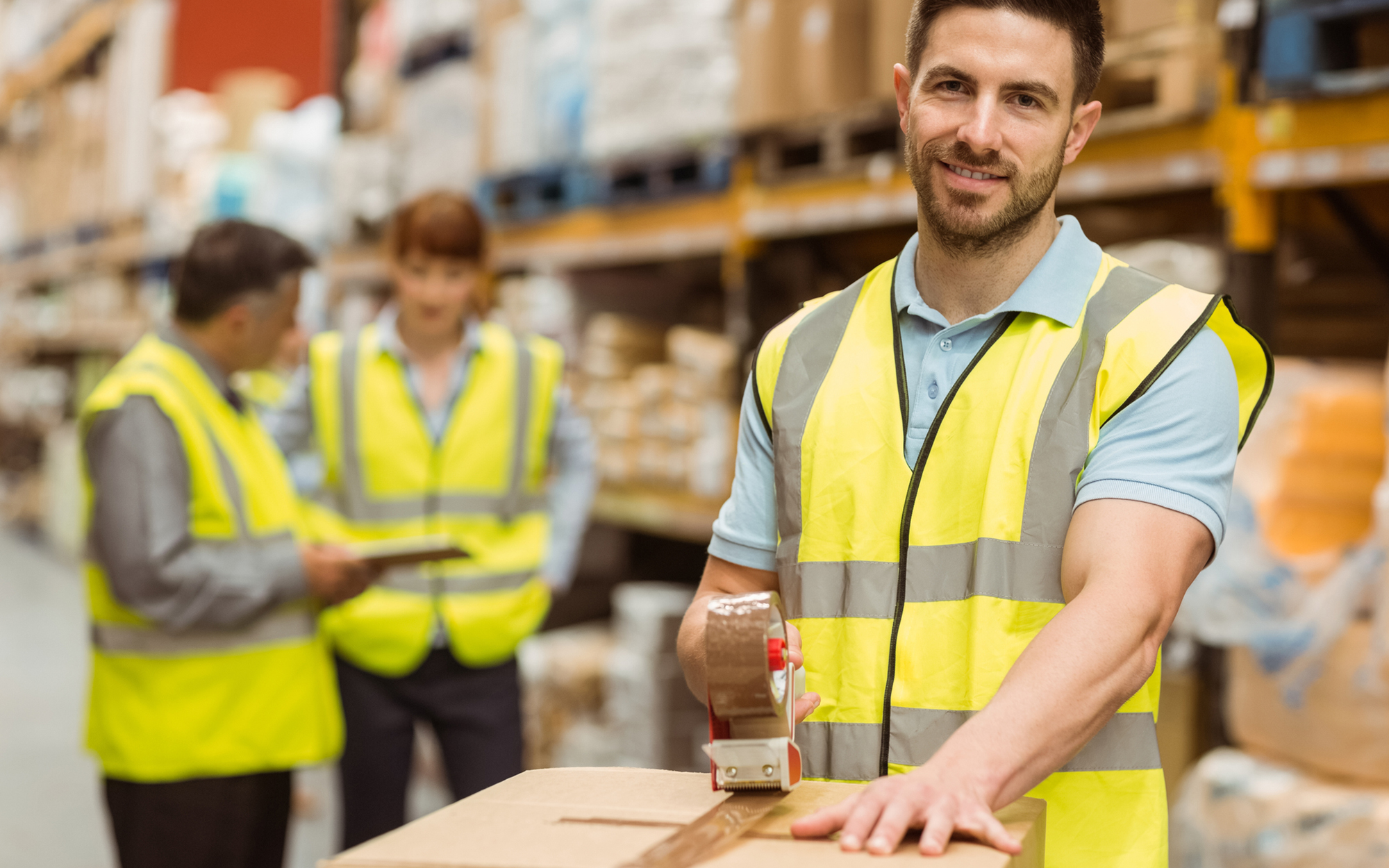 People in a Warehouse with Boxes